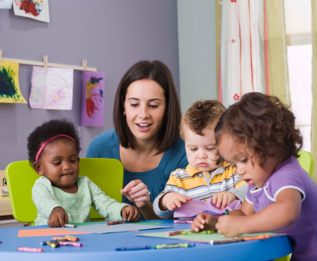 Young children playing in playroom